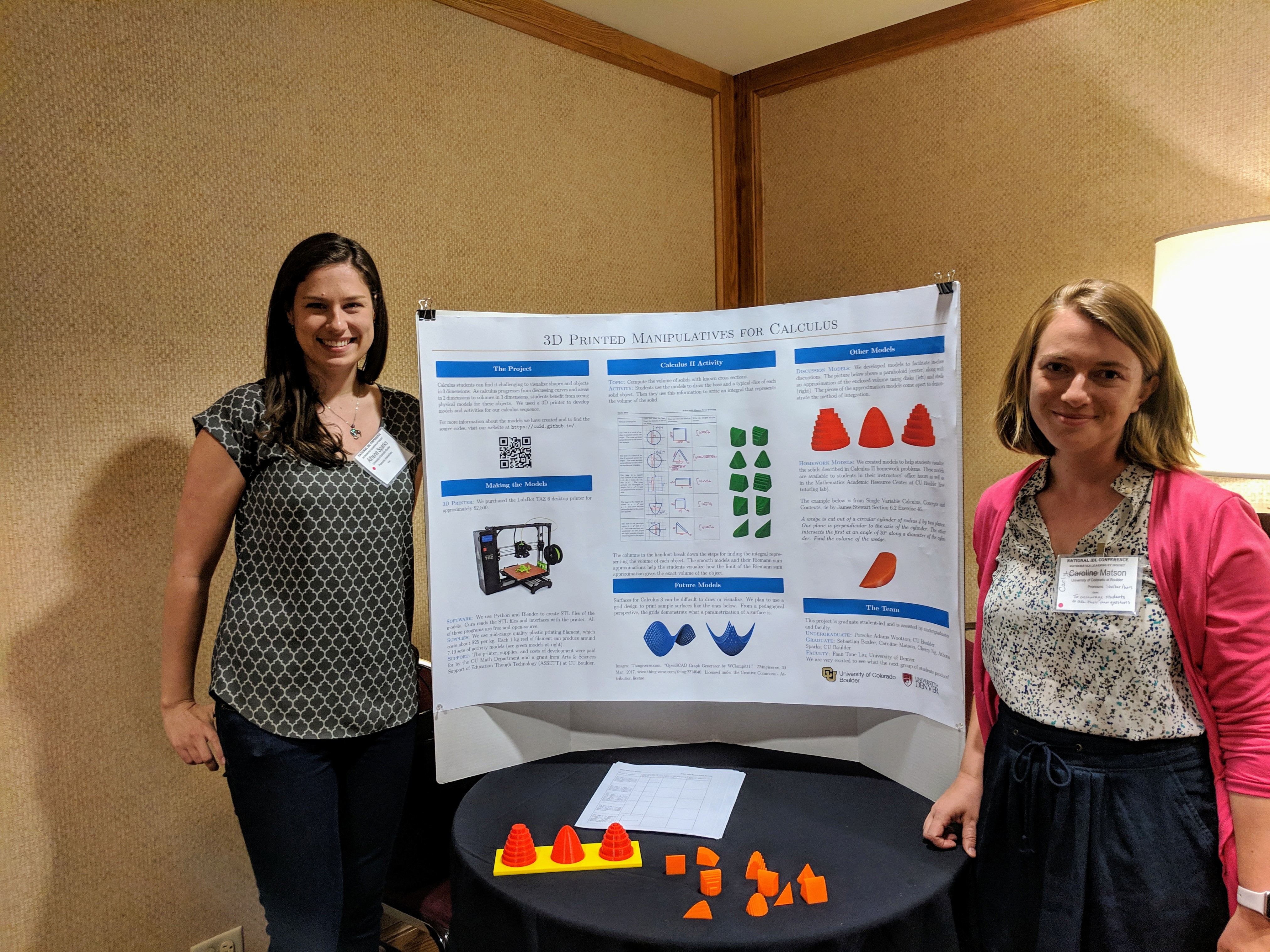 Carly and Athena presenting a poster on our work