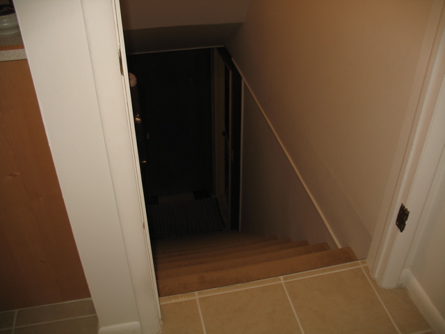 Stairs at back of kitchen